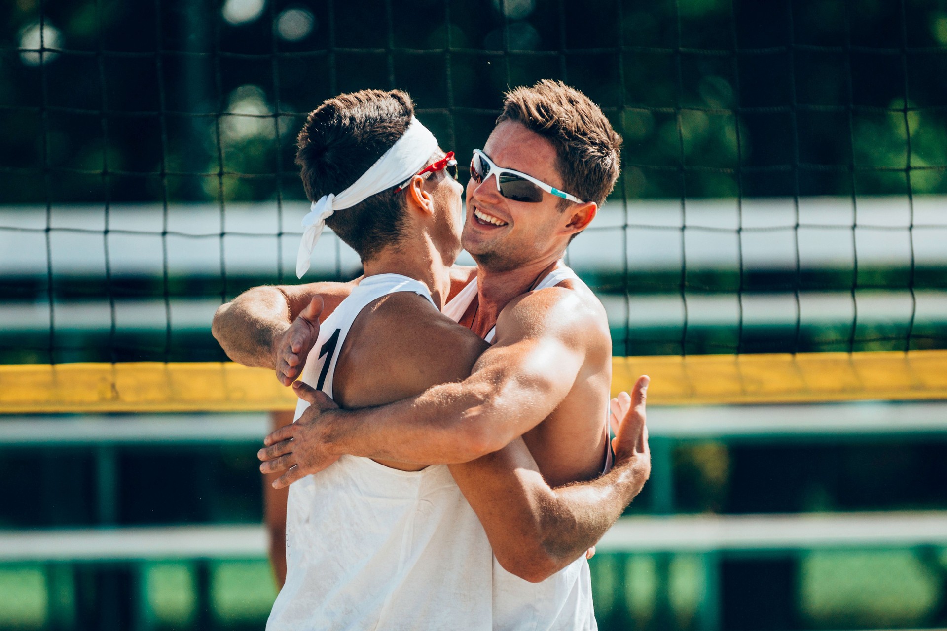 Beach volleyball team winning the game