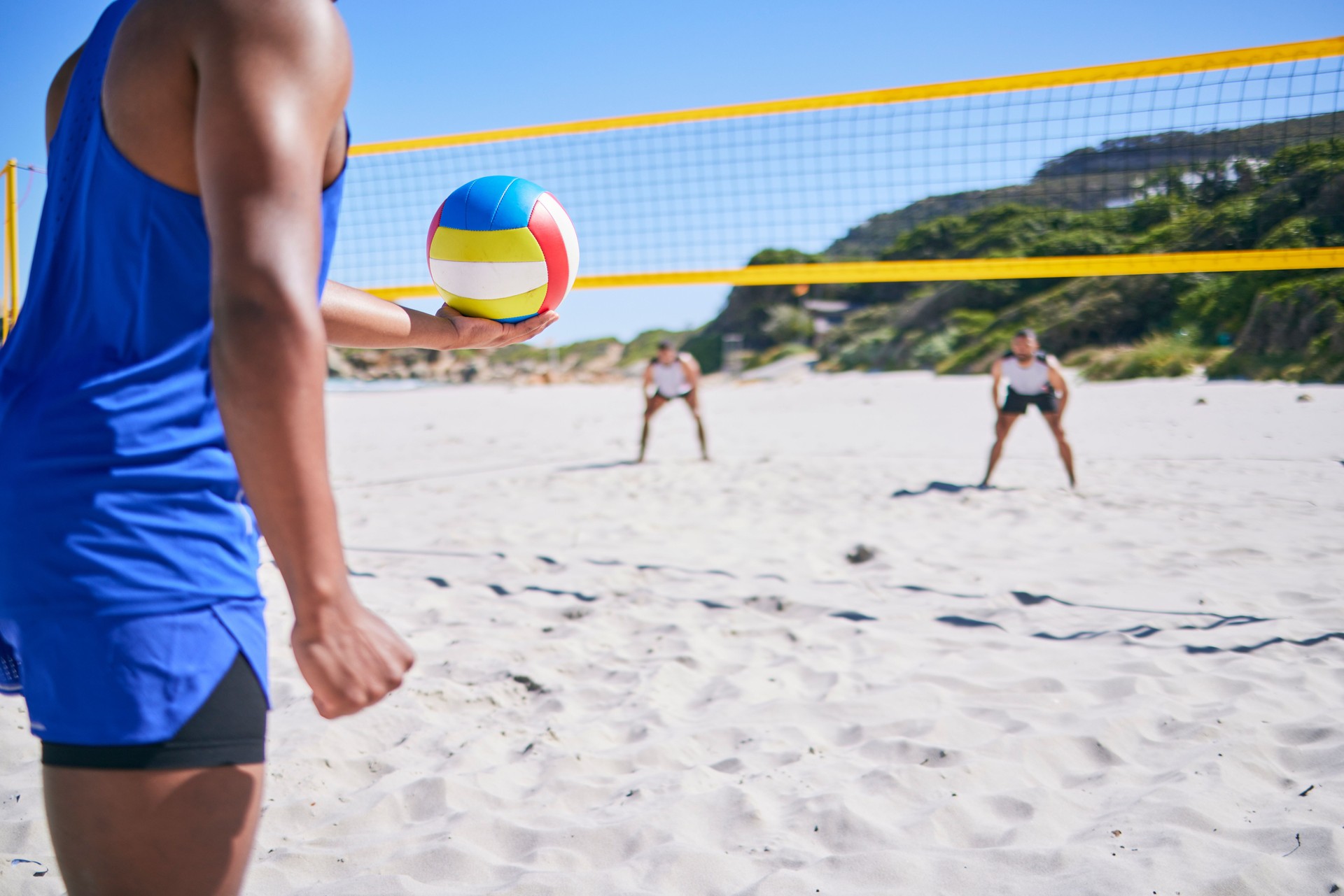 Beach volleyball, sports and person serve ball, play competition and match training for fitness challenge. Summer game, rival athlete and player workout, exercise and ready to start competitive game